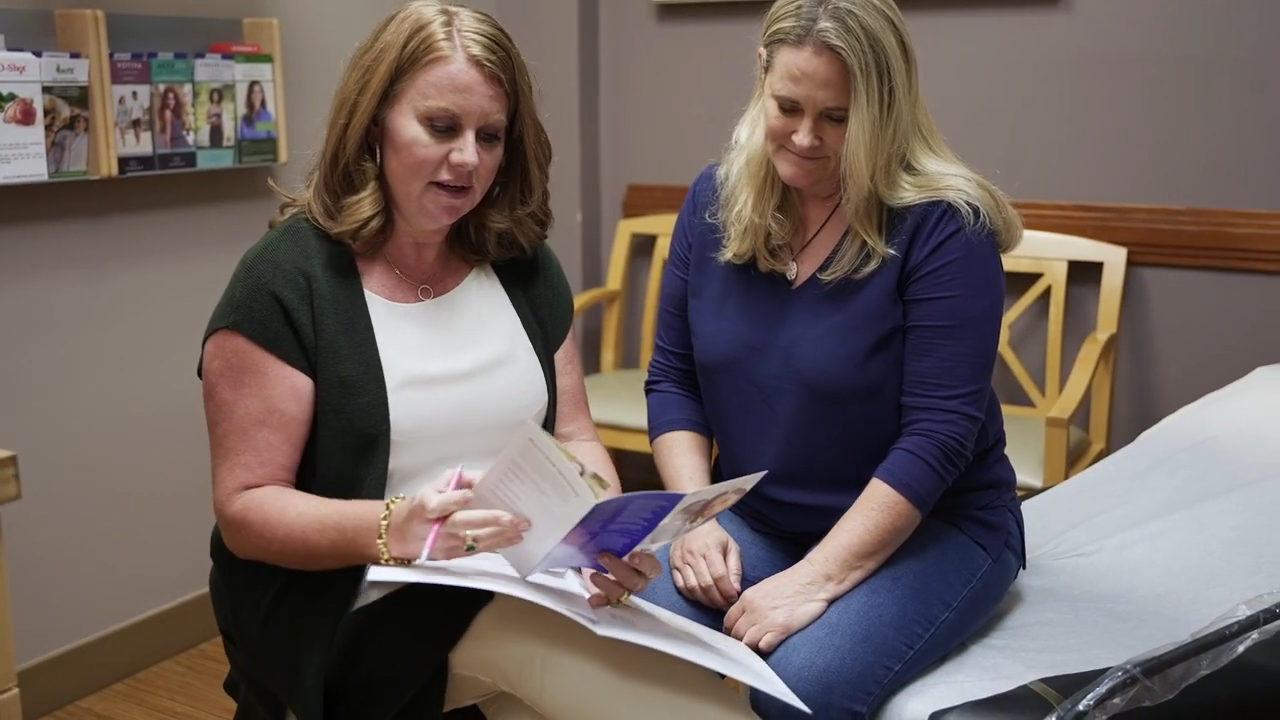 Dr. Jukes and Patient Looking at a Pamphlet