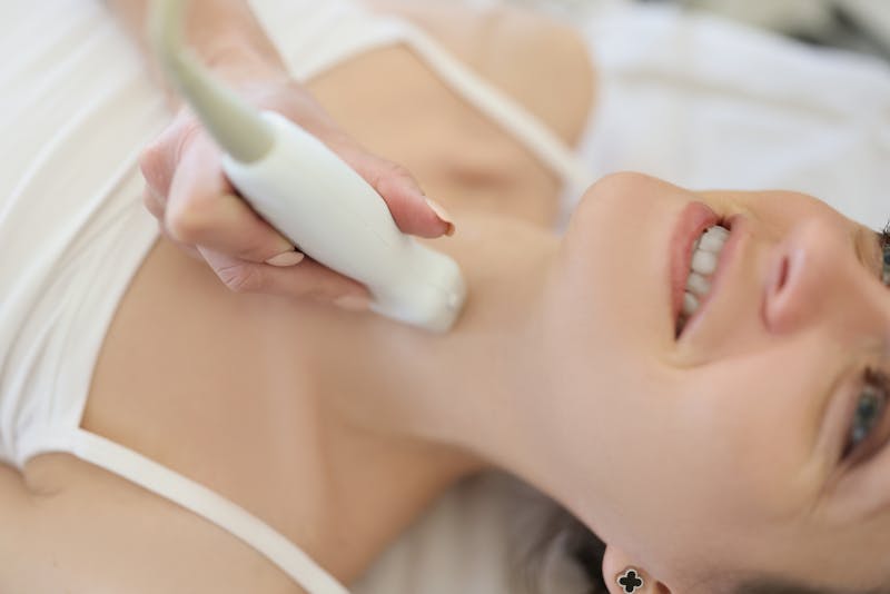 Woman Receiving Treatment on Her Neck