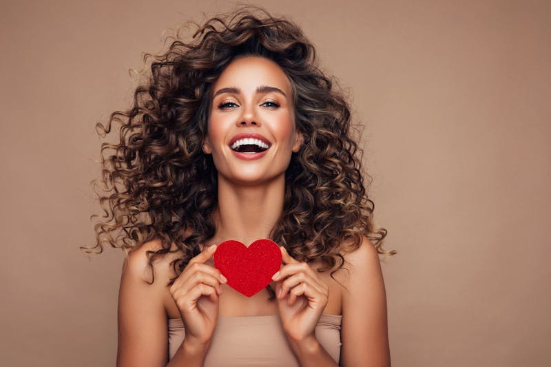 Woman Holding a Little Paper Heart