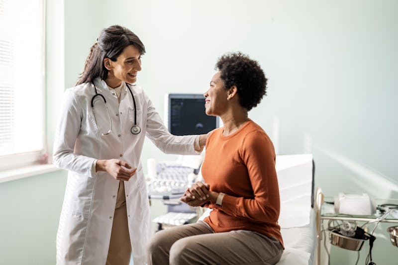 Woman talking to doctor