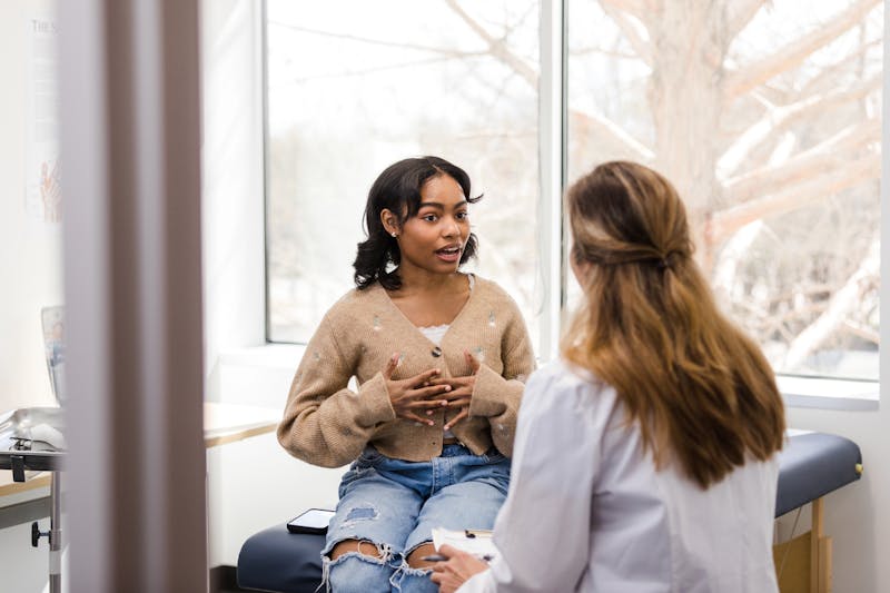 woman speaking to doctor