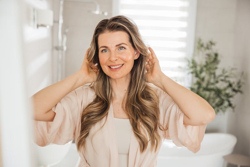 Woman touching her hair