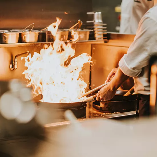 flaming wok in kitchen