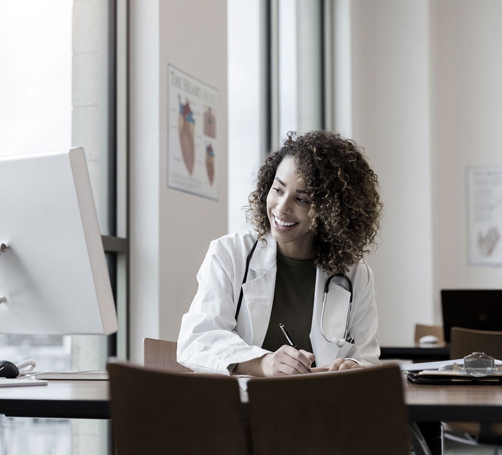 Female doctor working at a desk