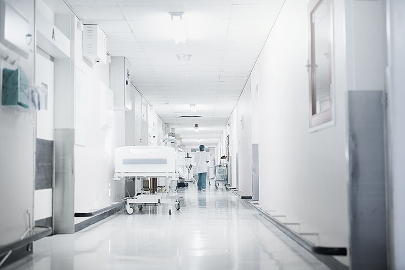 Photo of a pristine hospital hallway ready to care for their patients.