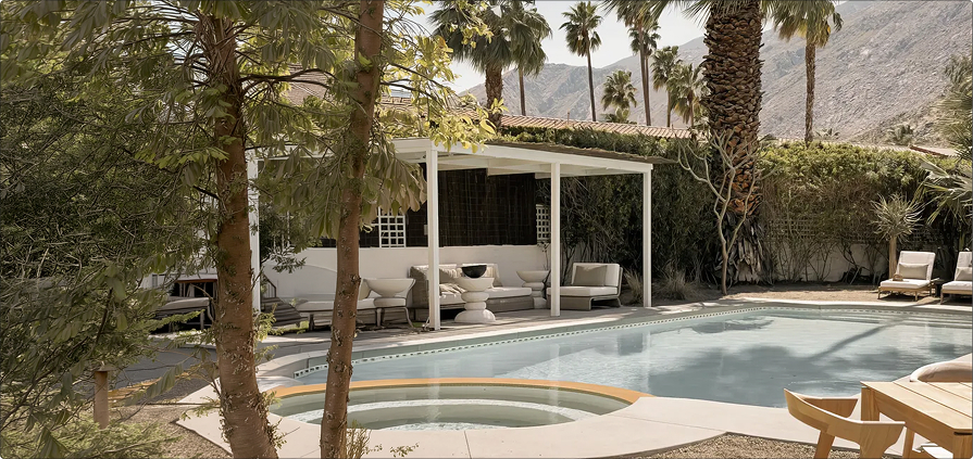 Desert villa poolside with palm trees