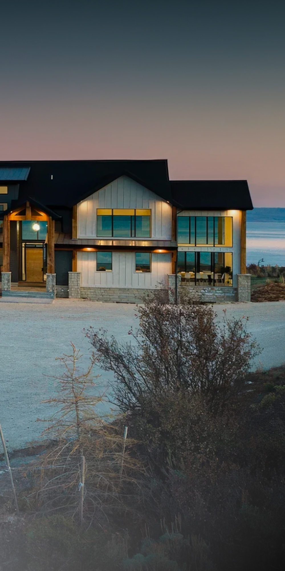Modern coastal home at dusk
