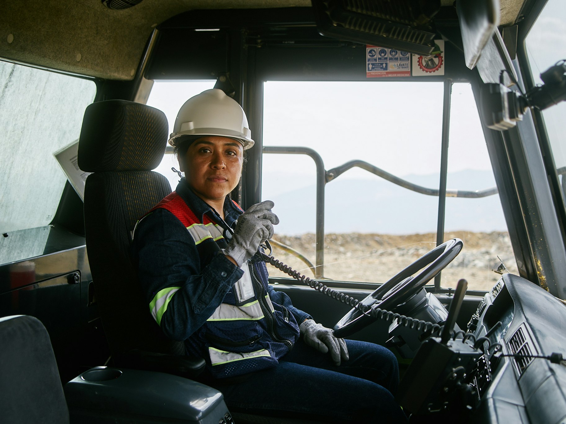 A woman driving a mining truck
