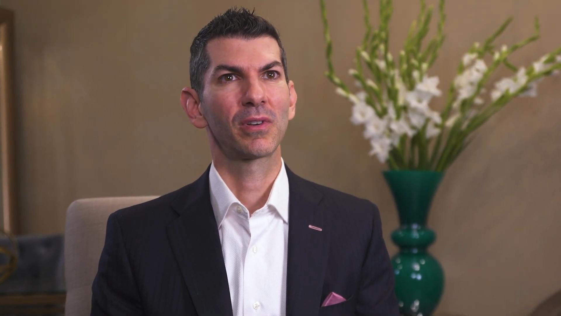 A headshot of Dr. Cappuccino in a video about dermal fillers