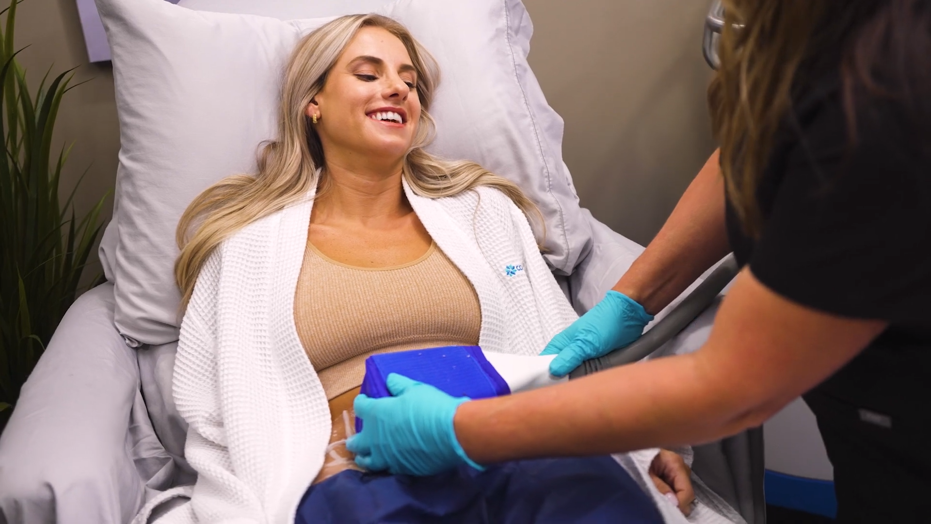 Blonde woman getting a CoolSculpting Treatment