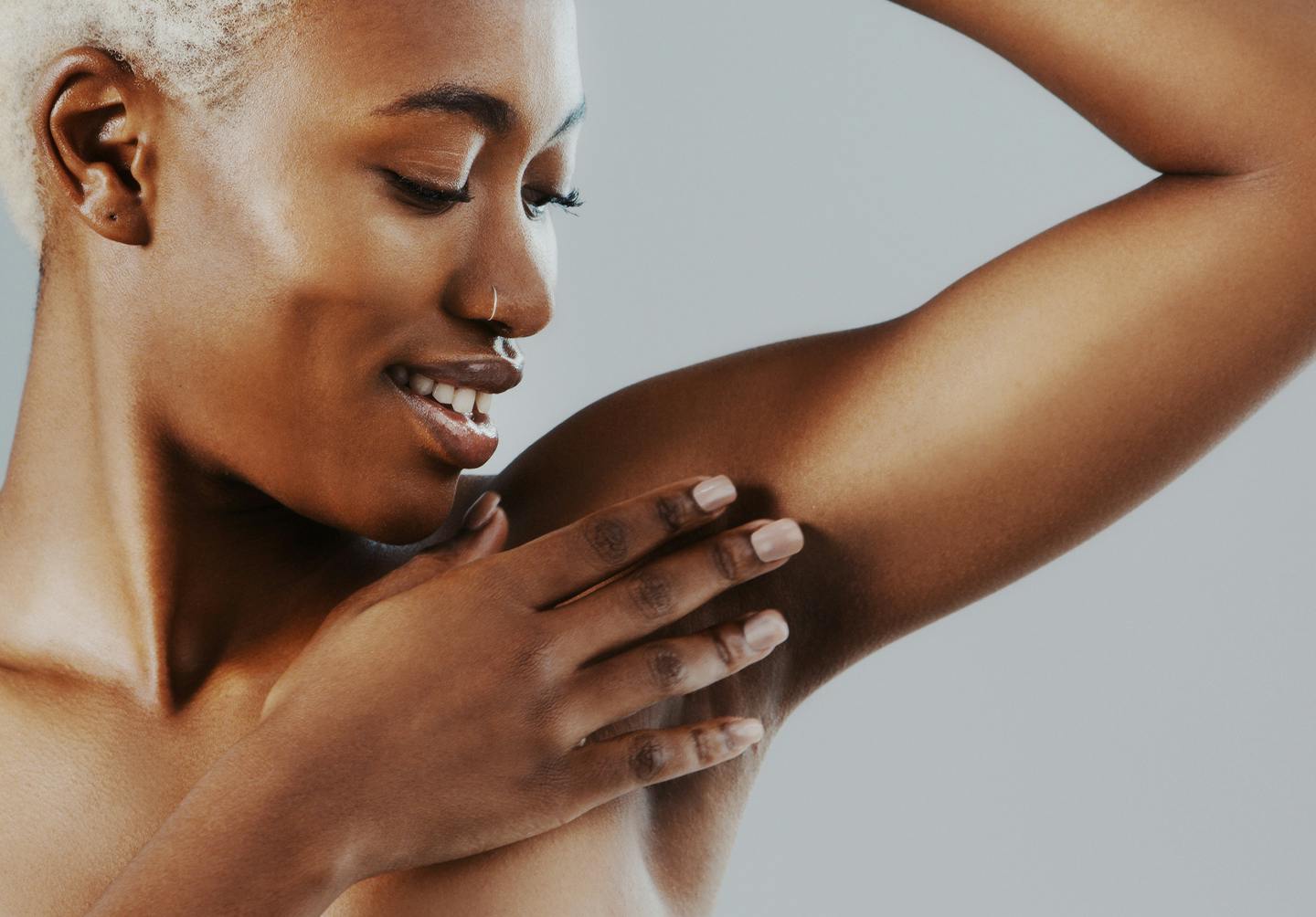 model admiring shaved underarms