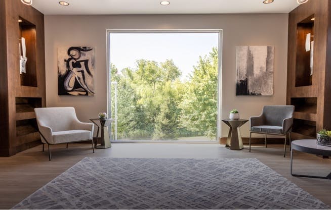 Wide view of waiting area with a large window in the center of photo