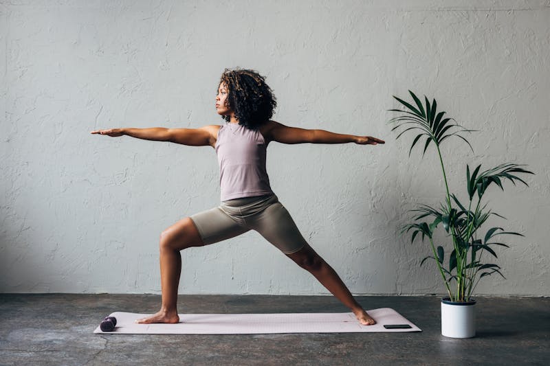 Woman stretching on a yoga mat