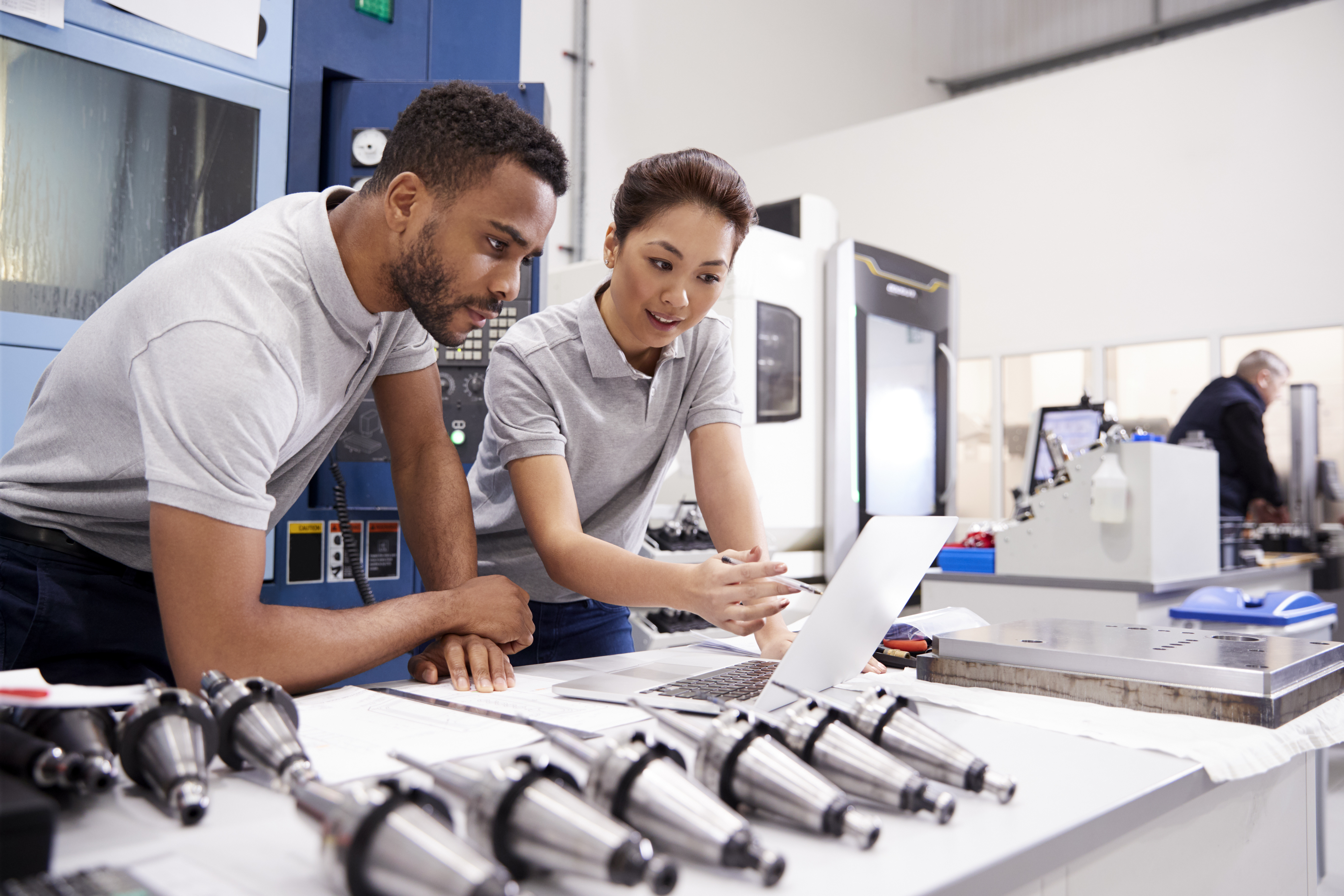 Two workers during the assembly process