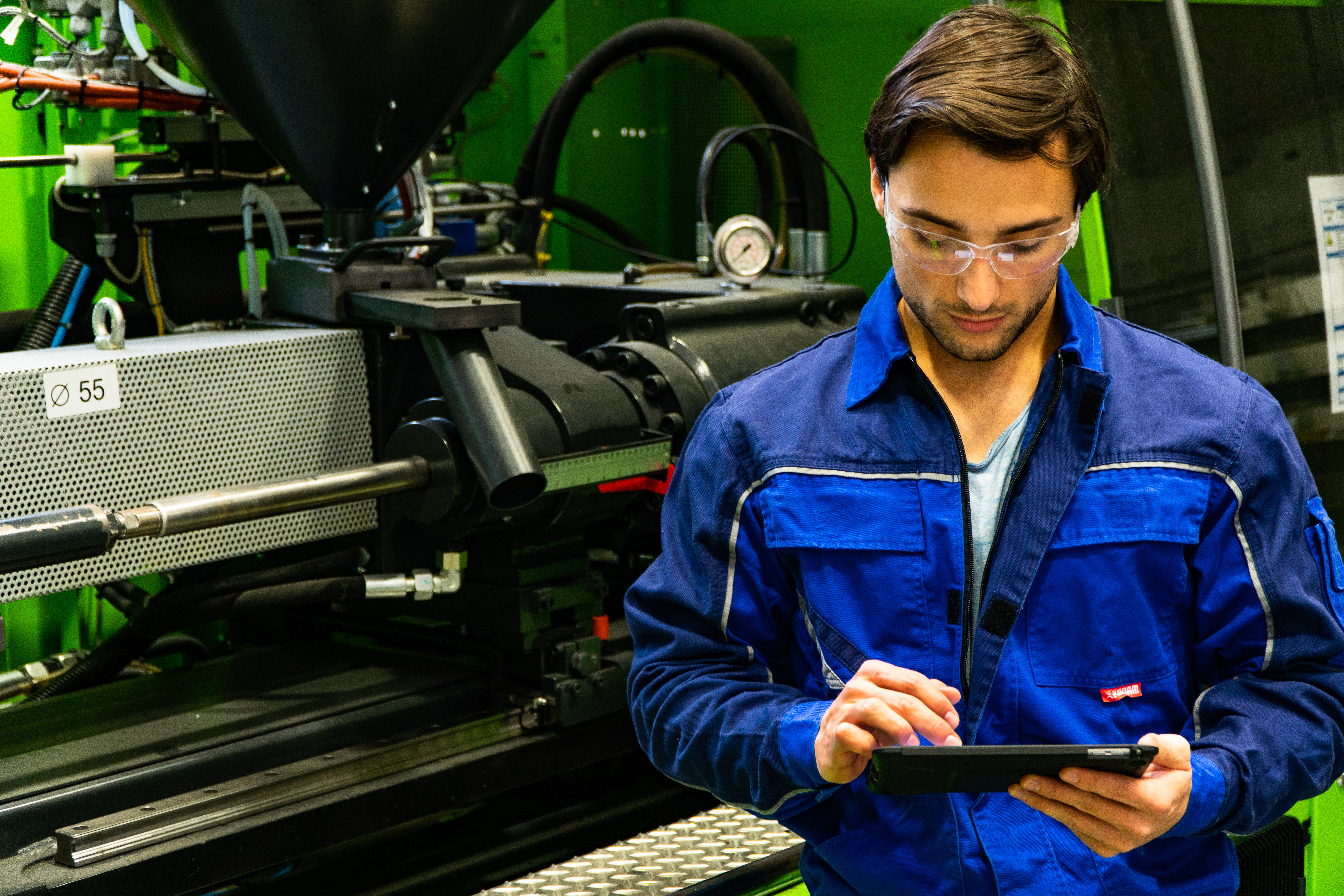 worker doing a digital factory acceptance test