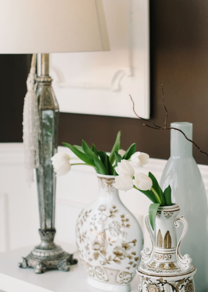 white flowers in vases on table