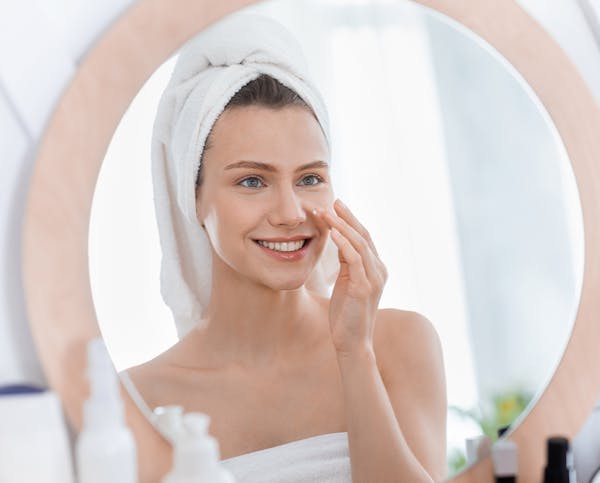 Patient admiring reflection after DermaSweep