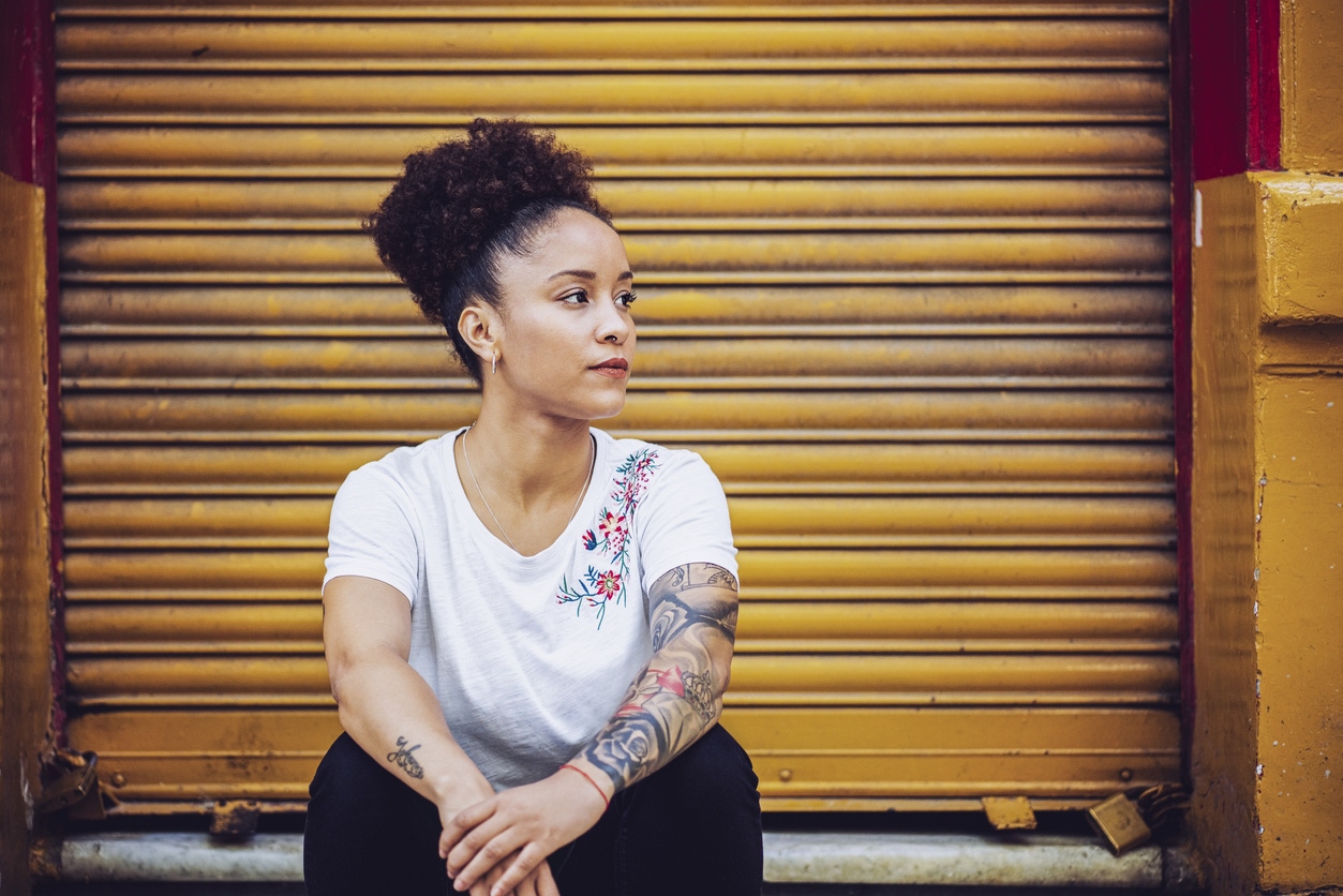 woman before getting No RAGRETS Laser Tattoo Removal