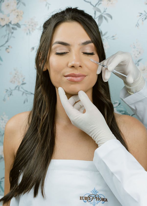 Woman getting designer bags injections