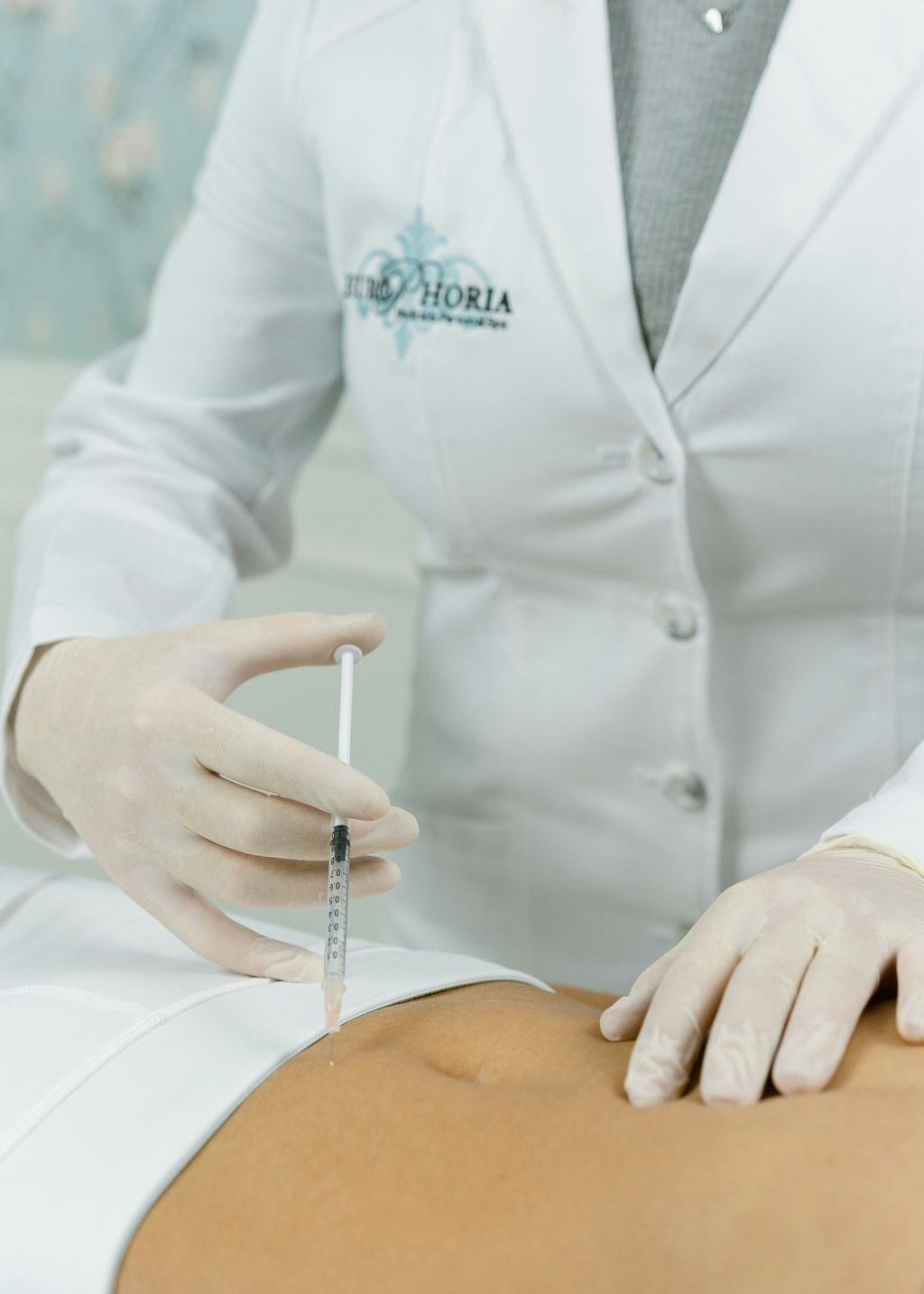 Doctor administering a FAT BOMB on a patient