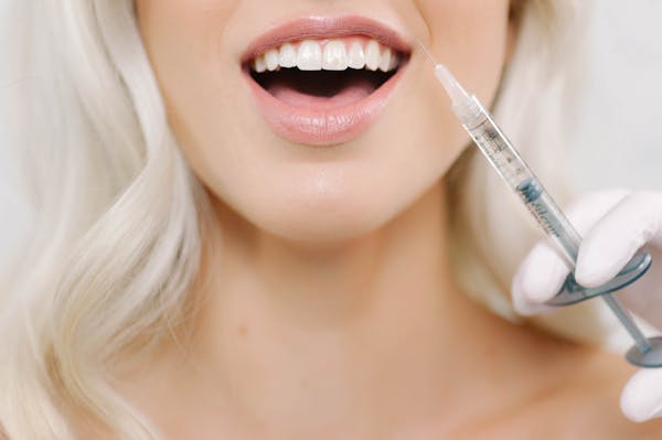 Woman getting lip injections