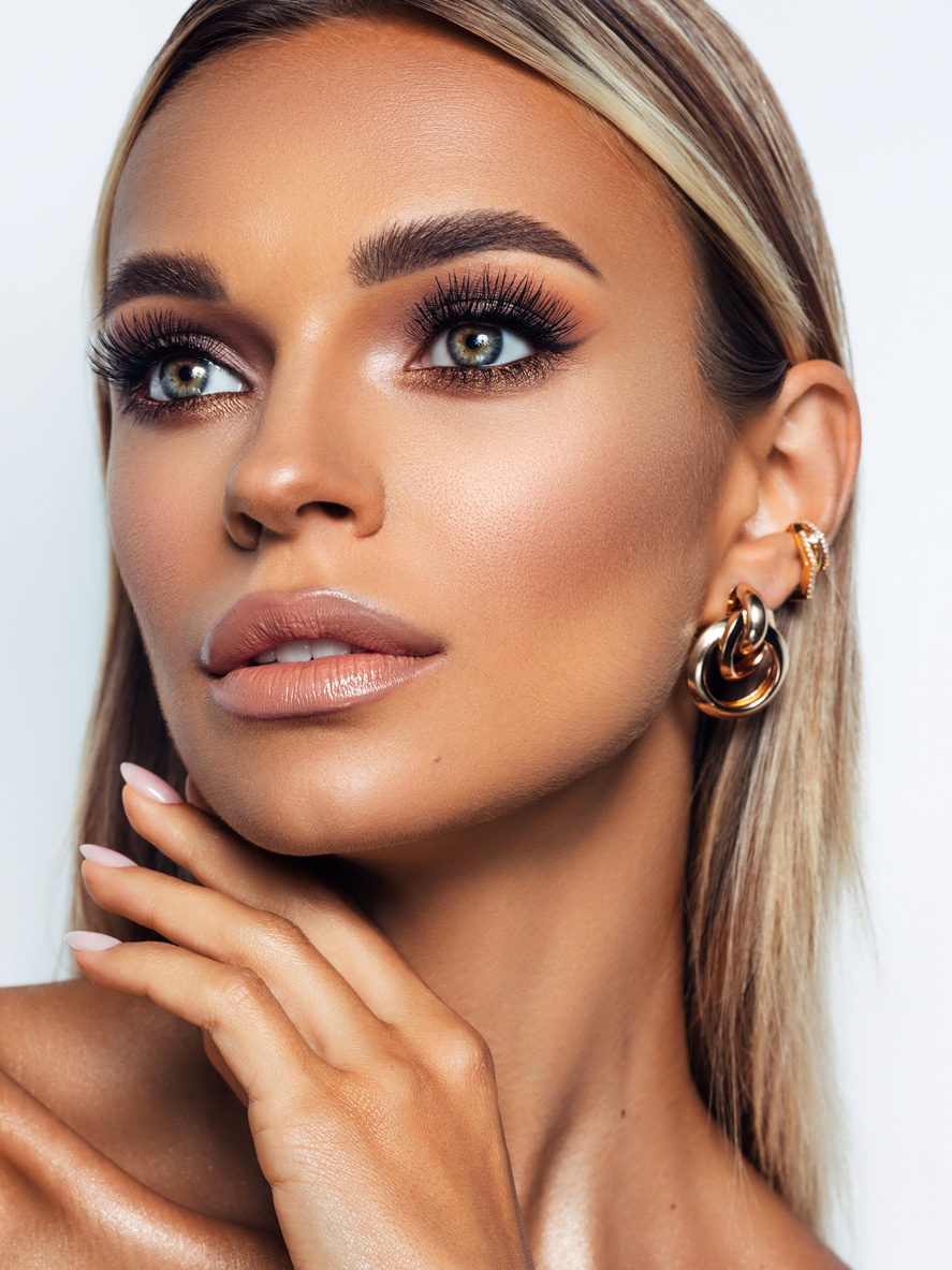 Woman with long eyelashes in studio shoot