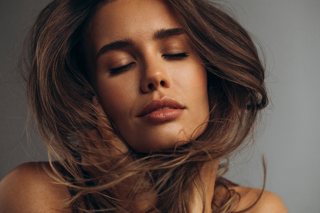 Woman with eyes closed in studio shoot