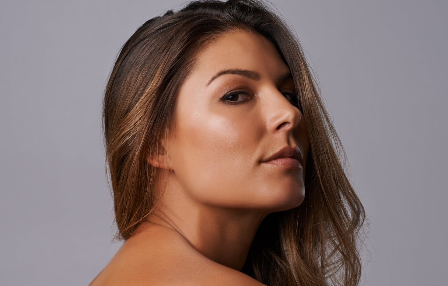 Woman with her hair pulled to the side