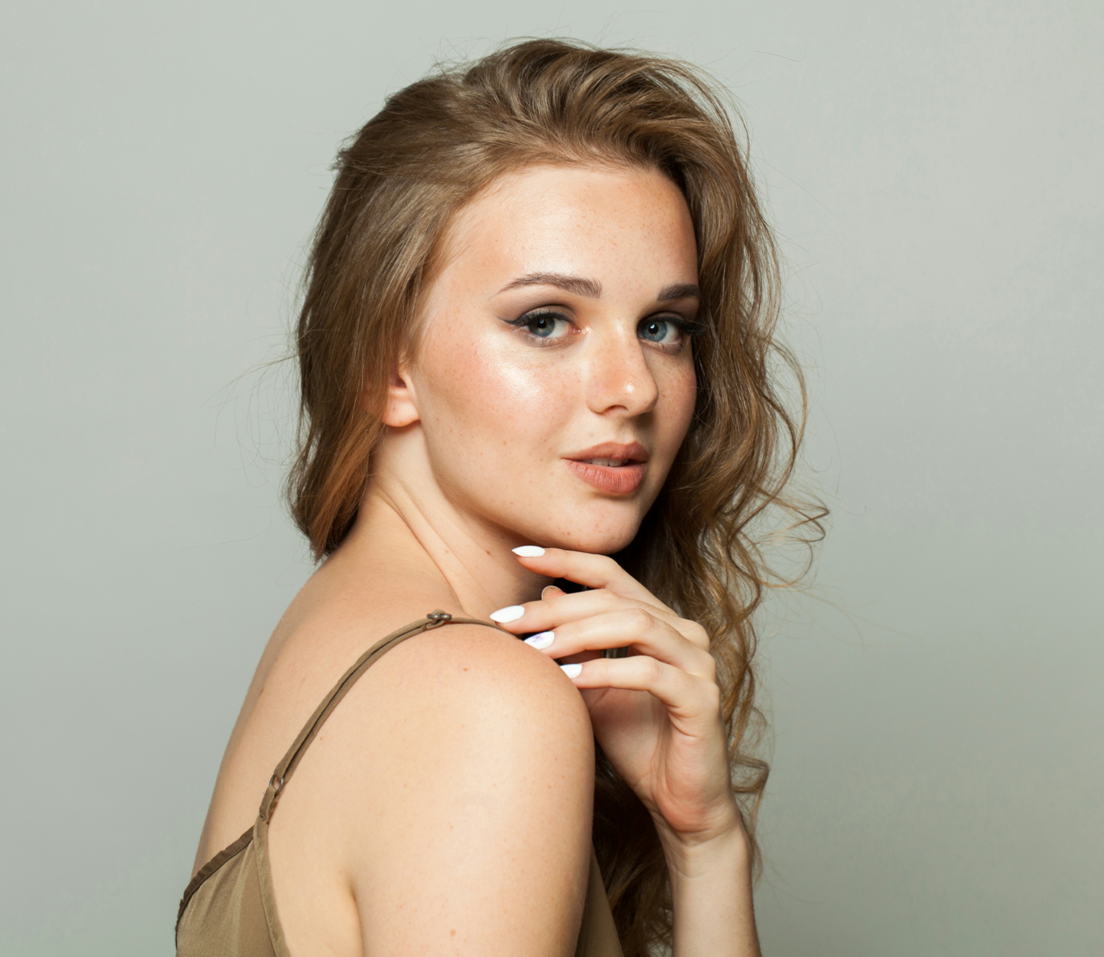 Woman with her hand on her chin