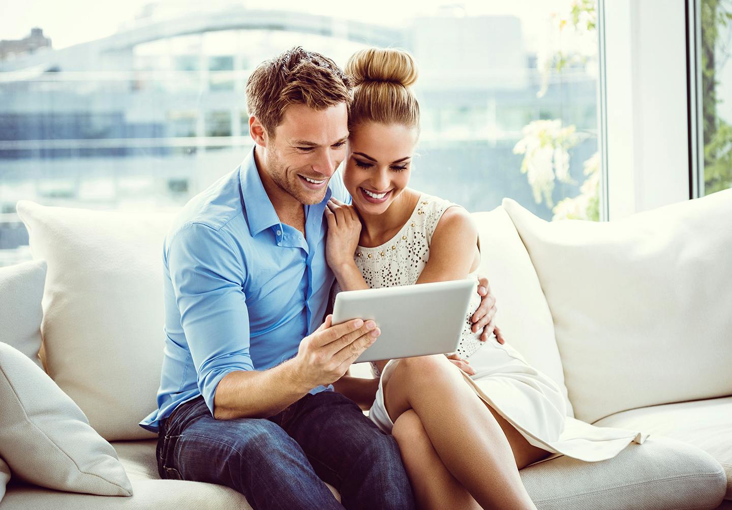 couple looking at tablet