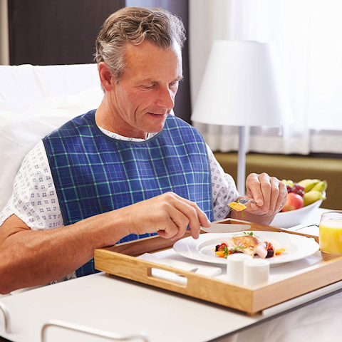 Elderly man with bib