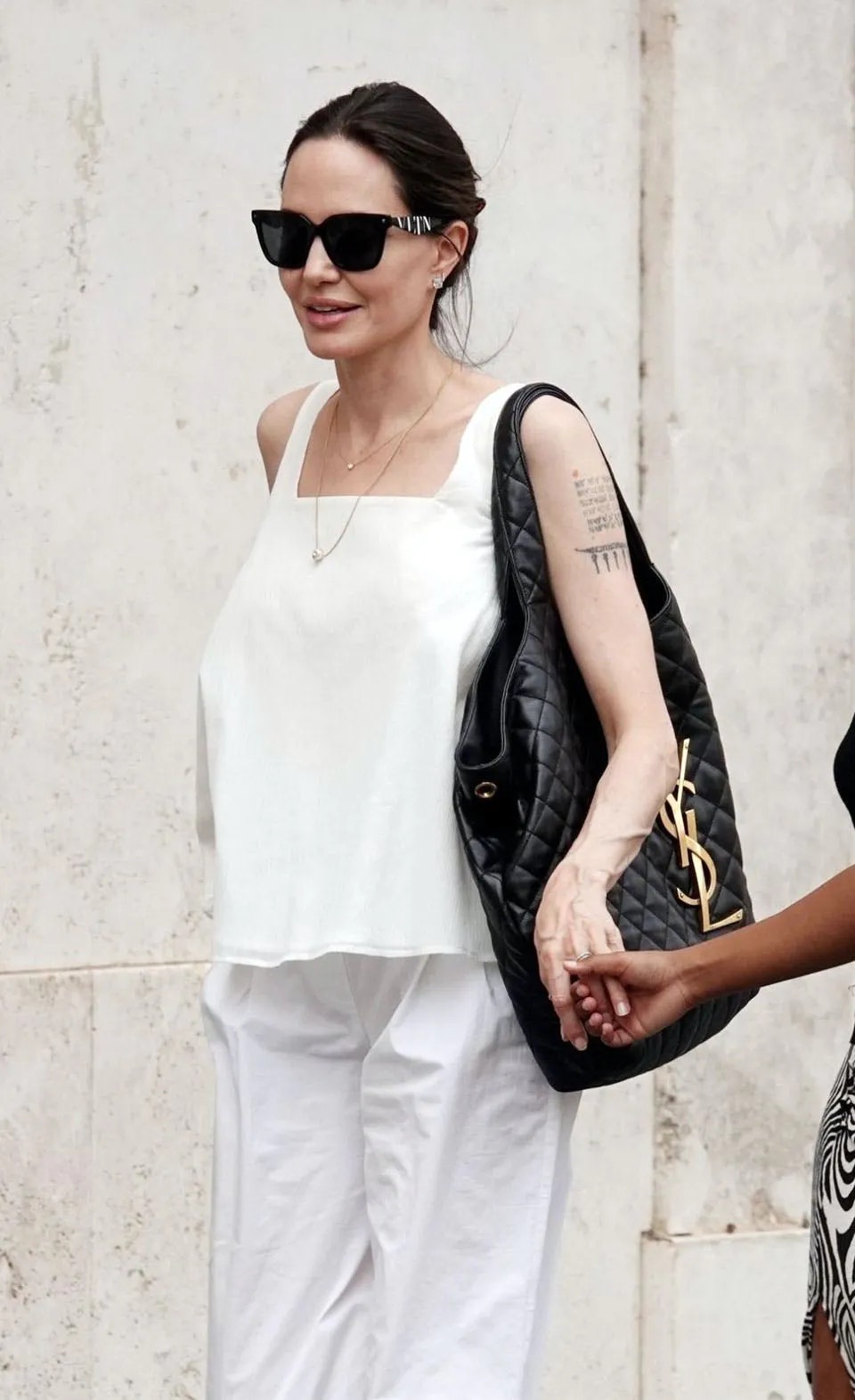 Angelina Jolie Sports Saint Laurent s Bag of the Season the ICARE