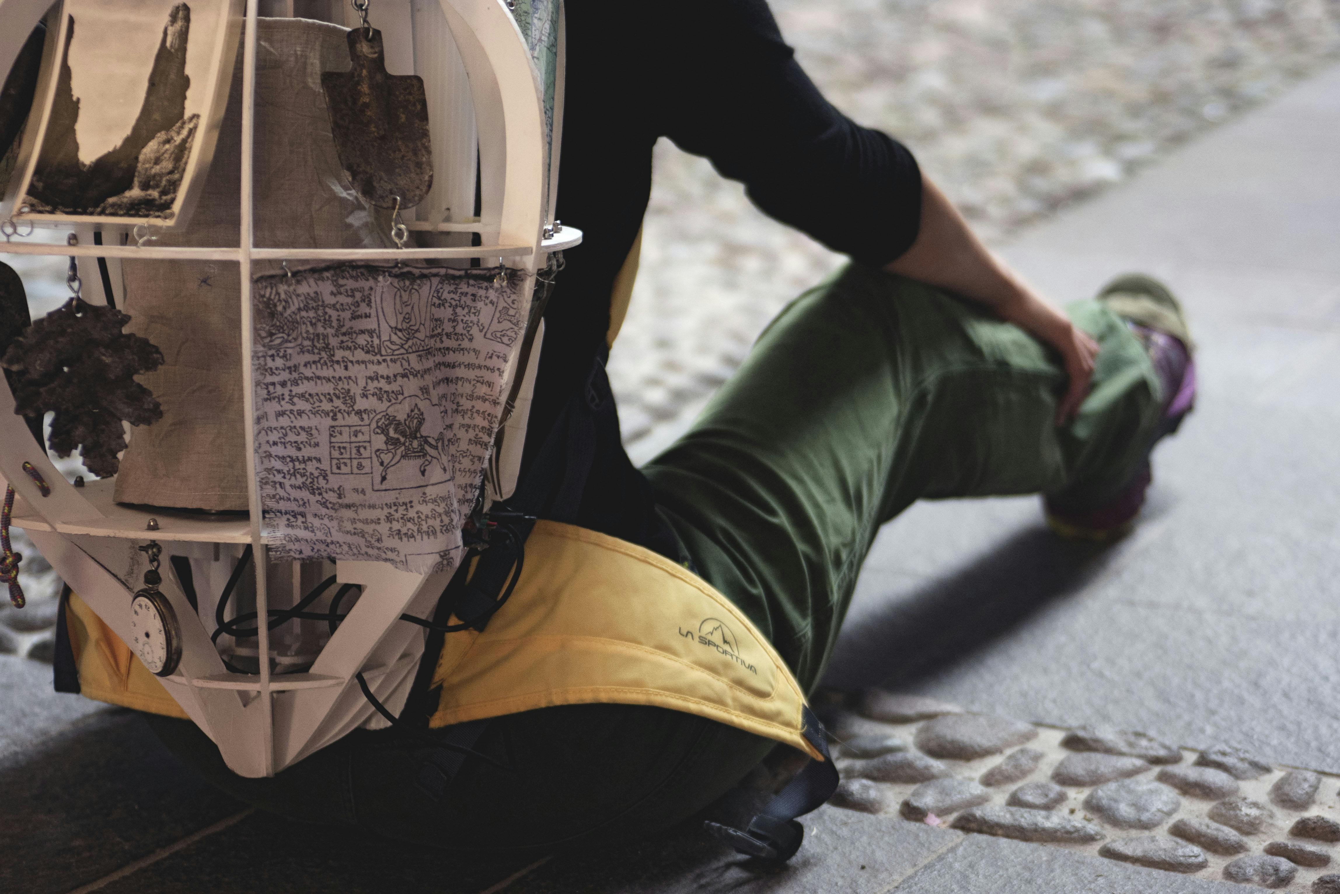 Filippo Porro sitting and photographed from behind, from the hip to the shoulders. 