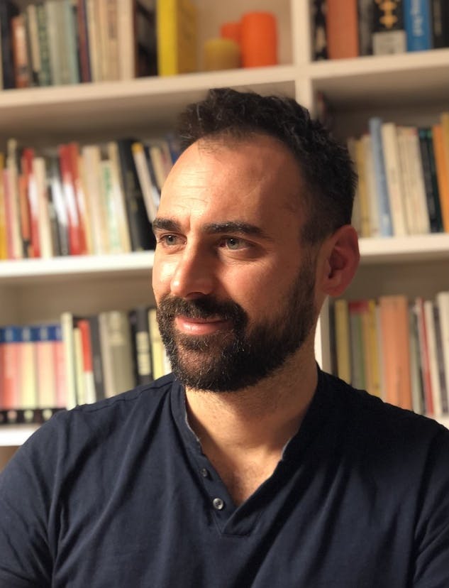Half-length portrait photo of Marco Guerini