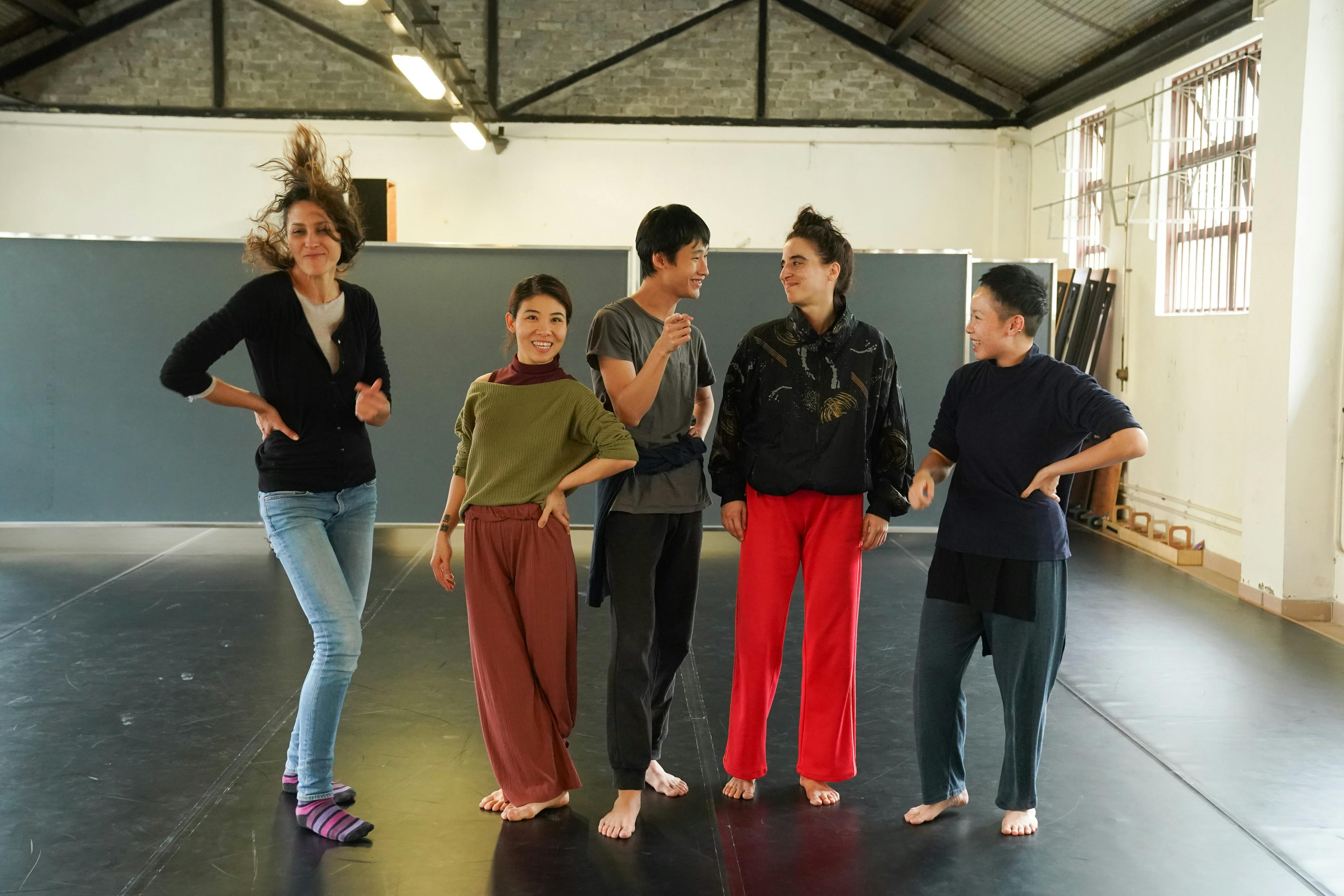 Luna Cenere along with Hong Kong performers in a dance studio.