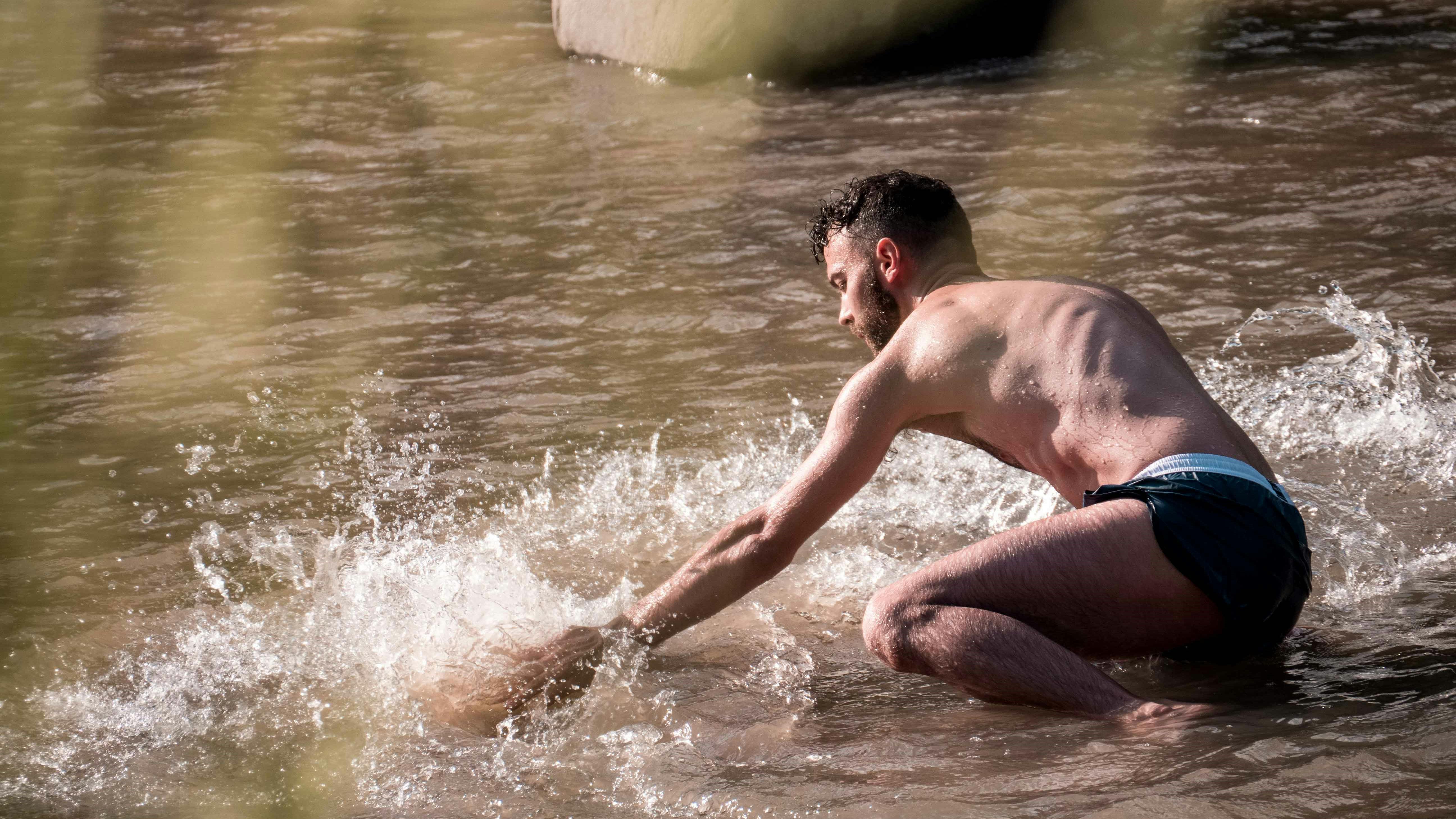 Lorenzo Morandini in a river kneeling on water