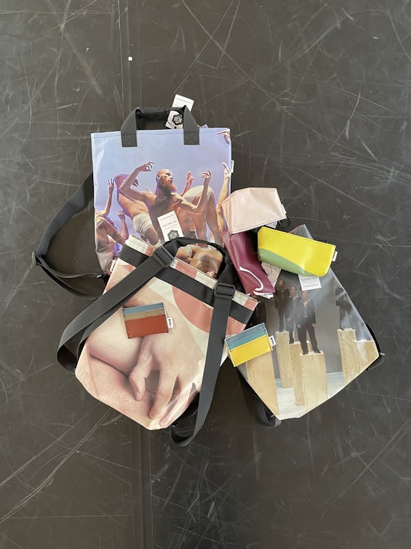 Backpacks and cases made by Redo placed on the dance floor in our studio