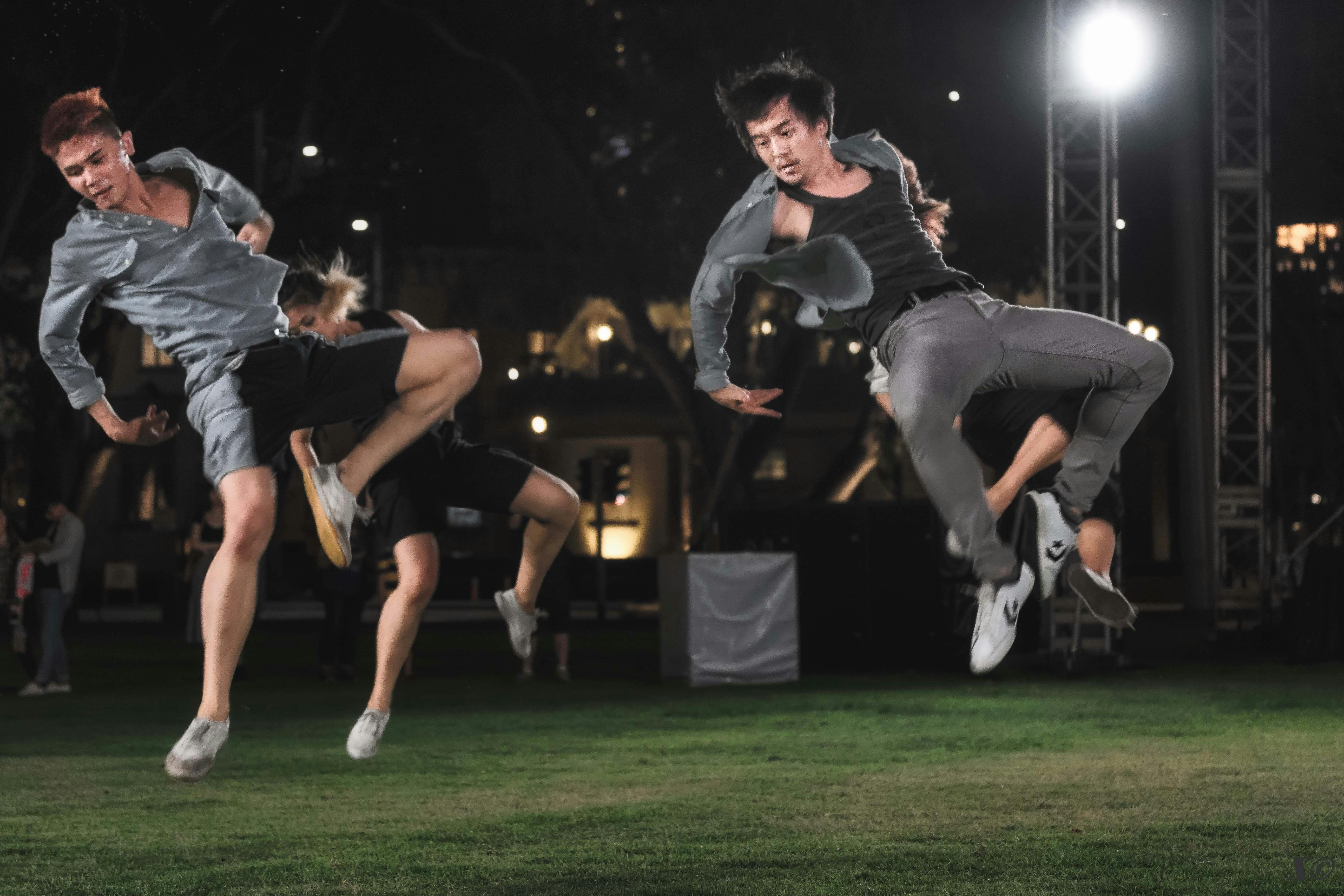 Dancers perform an open-air jump