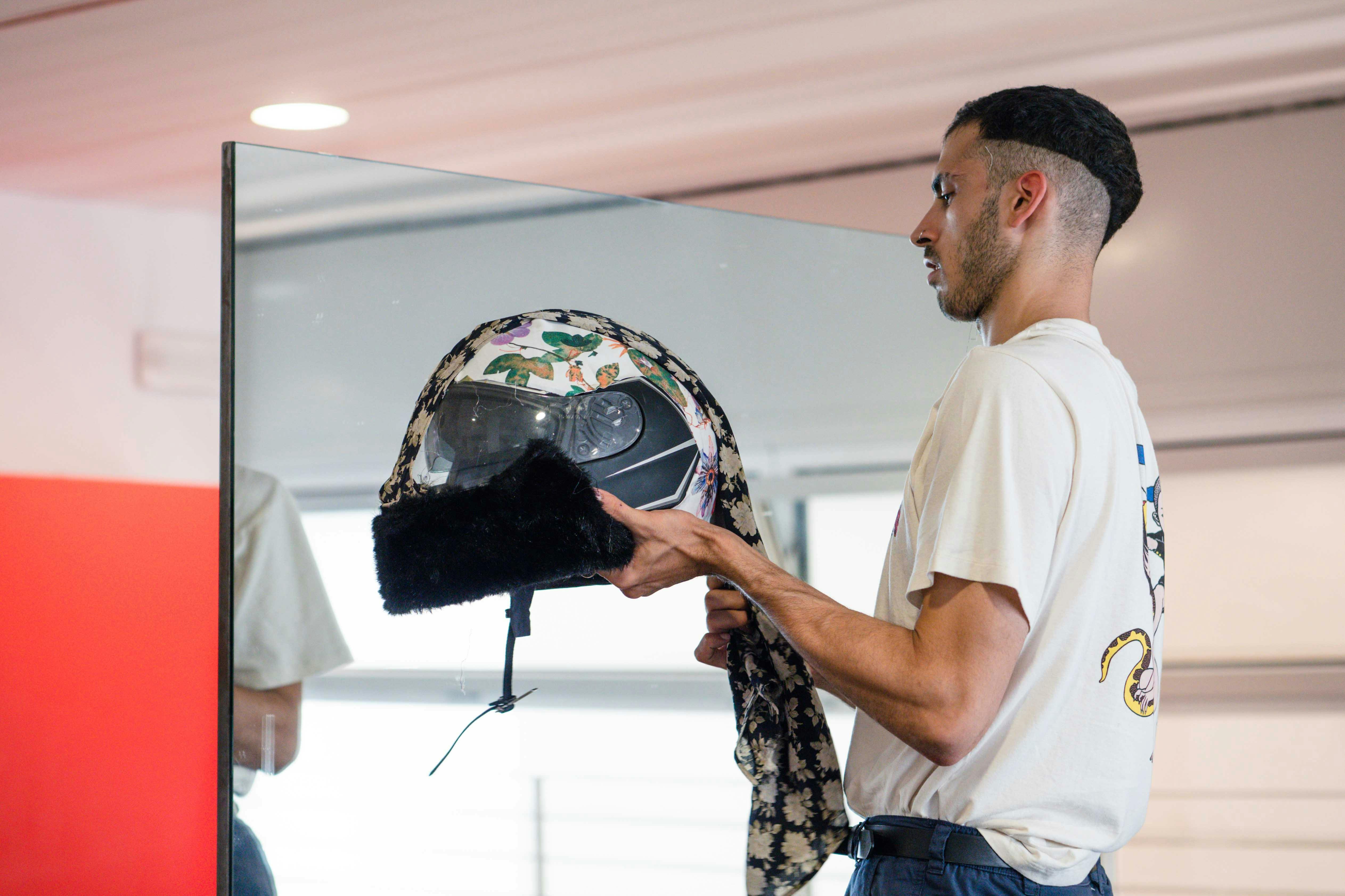 Artist Ludovico Paladini mirrors himself holding a case recovered at CRM