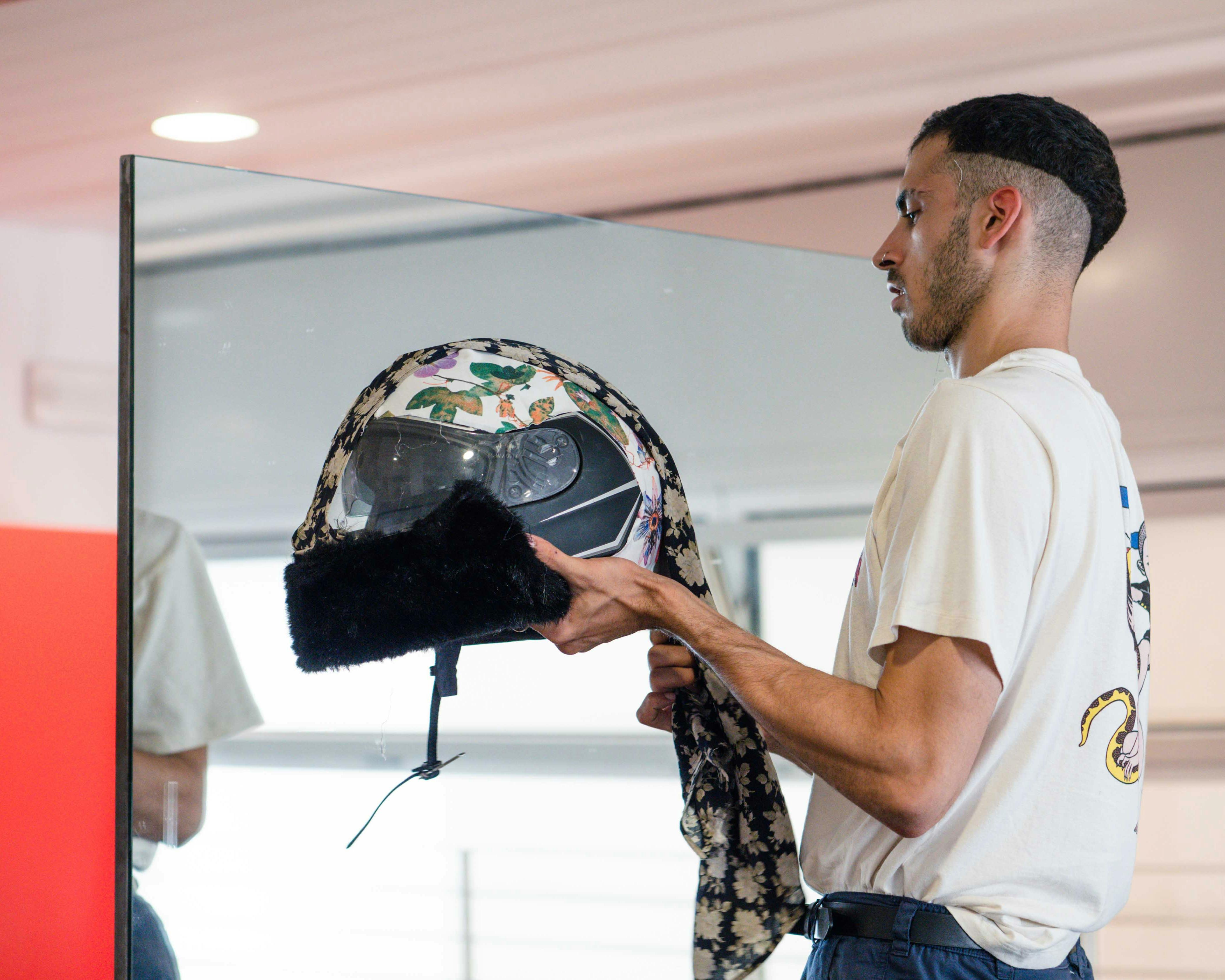 Artist Ludovico Paladini mirrors himself holding a case recovered at CRM