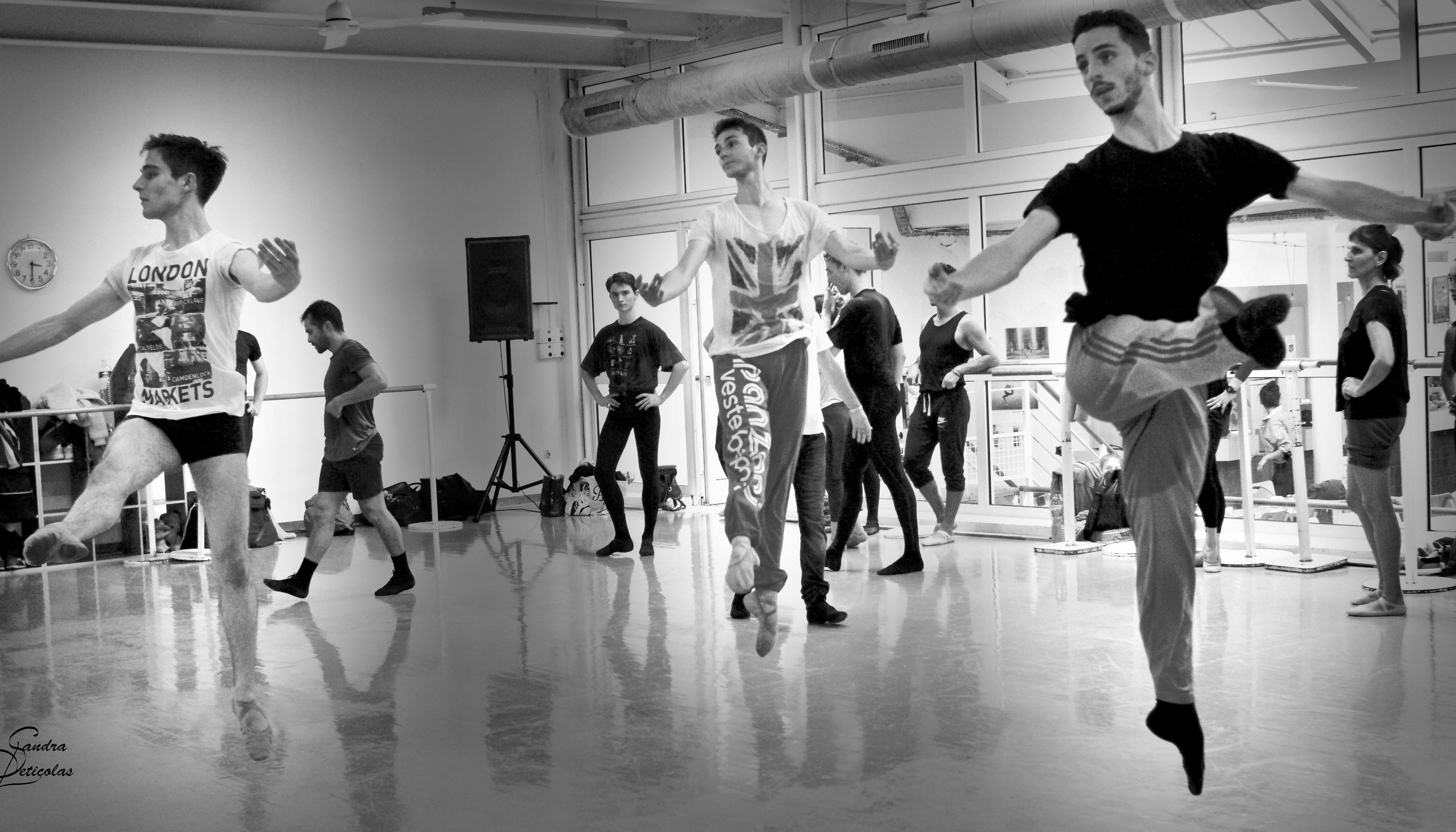 A black and white photo of Wayne Byars students performing a jump in class