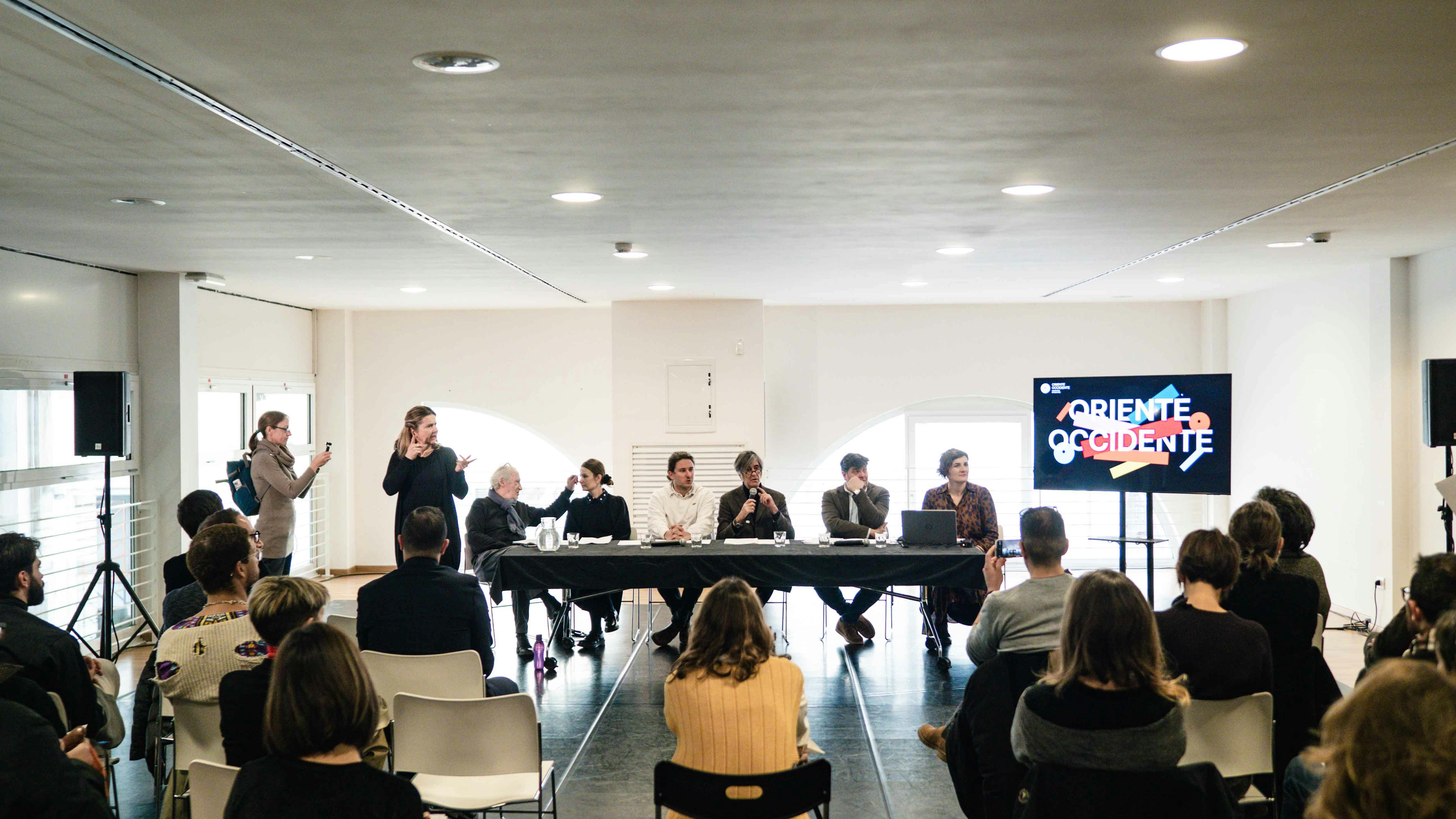 Press conference February 2023 Table with conference speakers and back audience