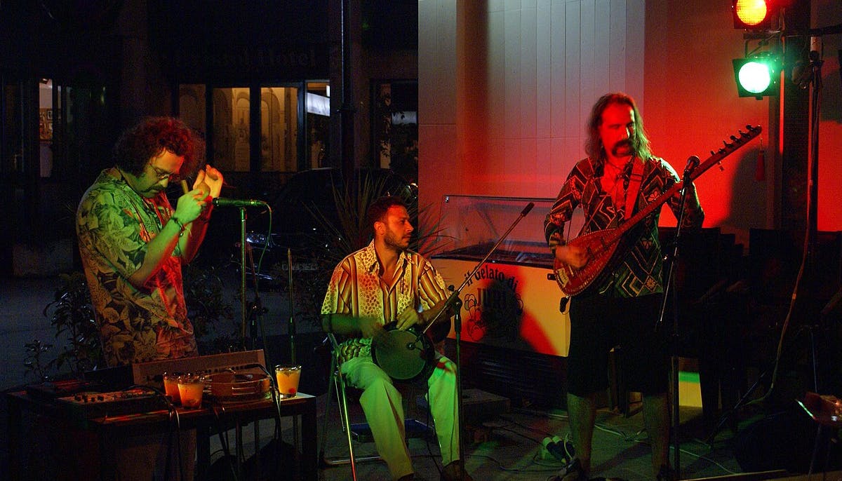 Three of the five musicians in the band while playing some instrumental