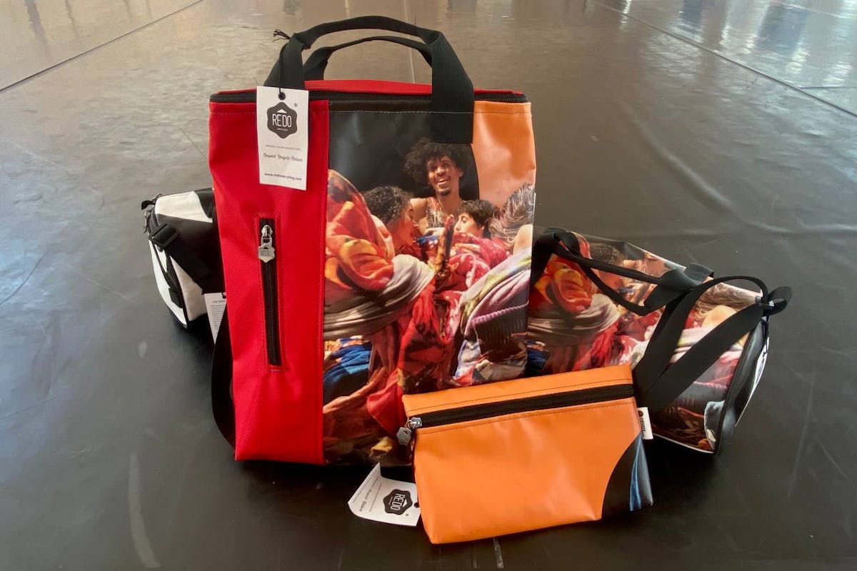 Backpacks and bags created with posters from the 2022 edition of Oriente Occidente Dance Festival