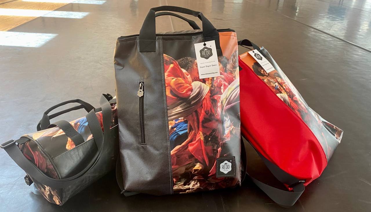Backpacks created with posters from the 2022 edition of Oriente Occidente Dance Festival