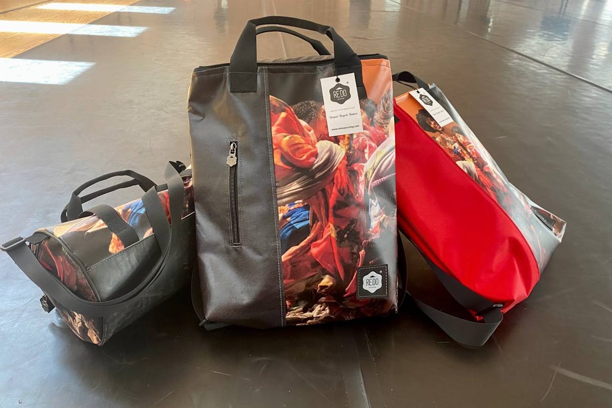Backpacks created with posters from the 2022 edition of Oriente Occidente Dance Festival