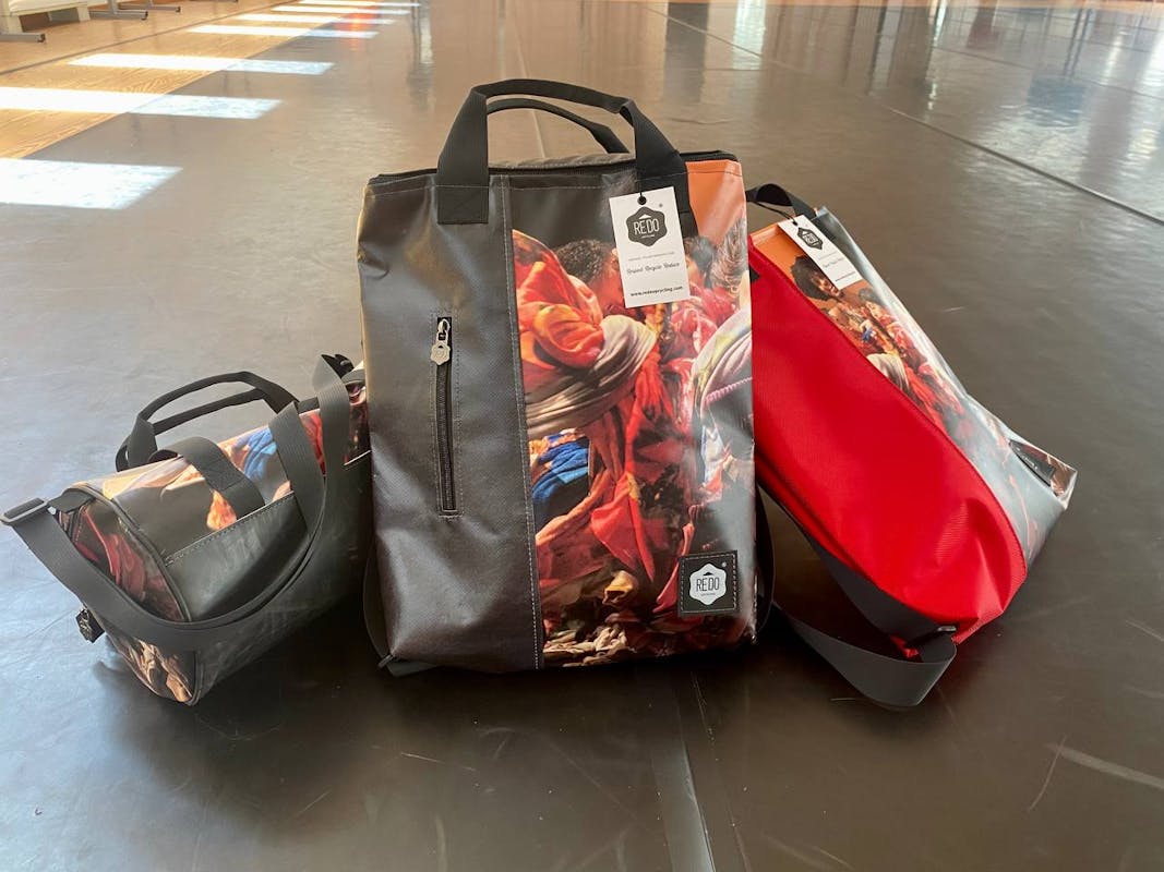 Backpacks created with posters from the 2022 edition of Oriente Occidente Dance Festival