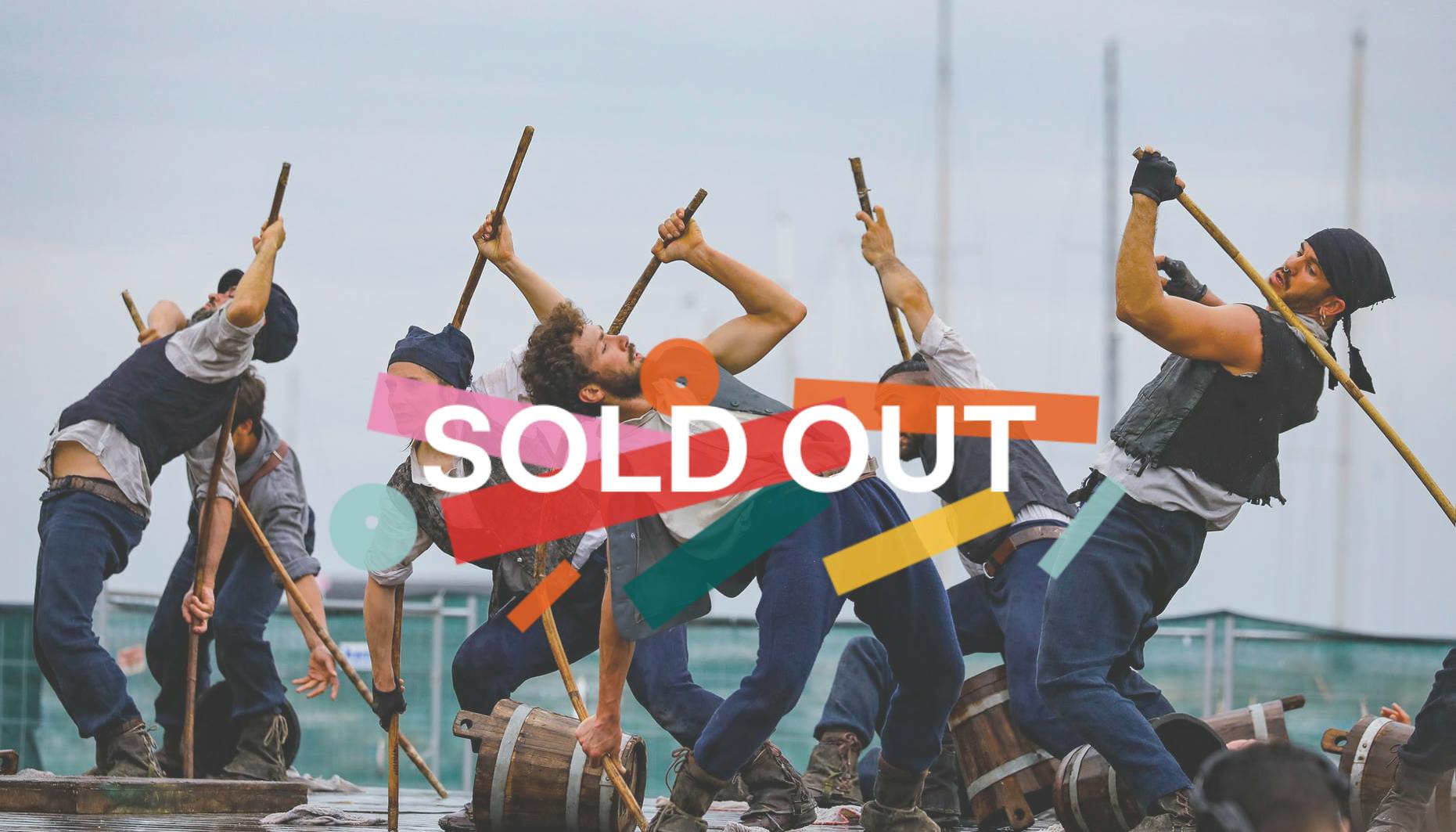 Performers play sailors on the backdrop of a boat, embossed the sign for the sold-out event.