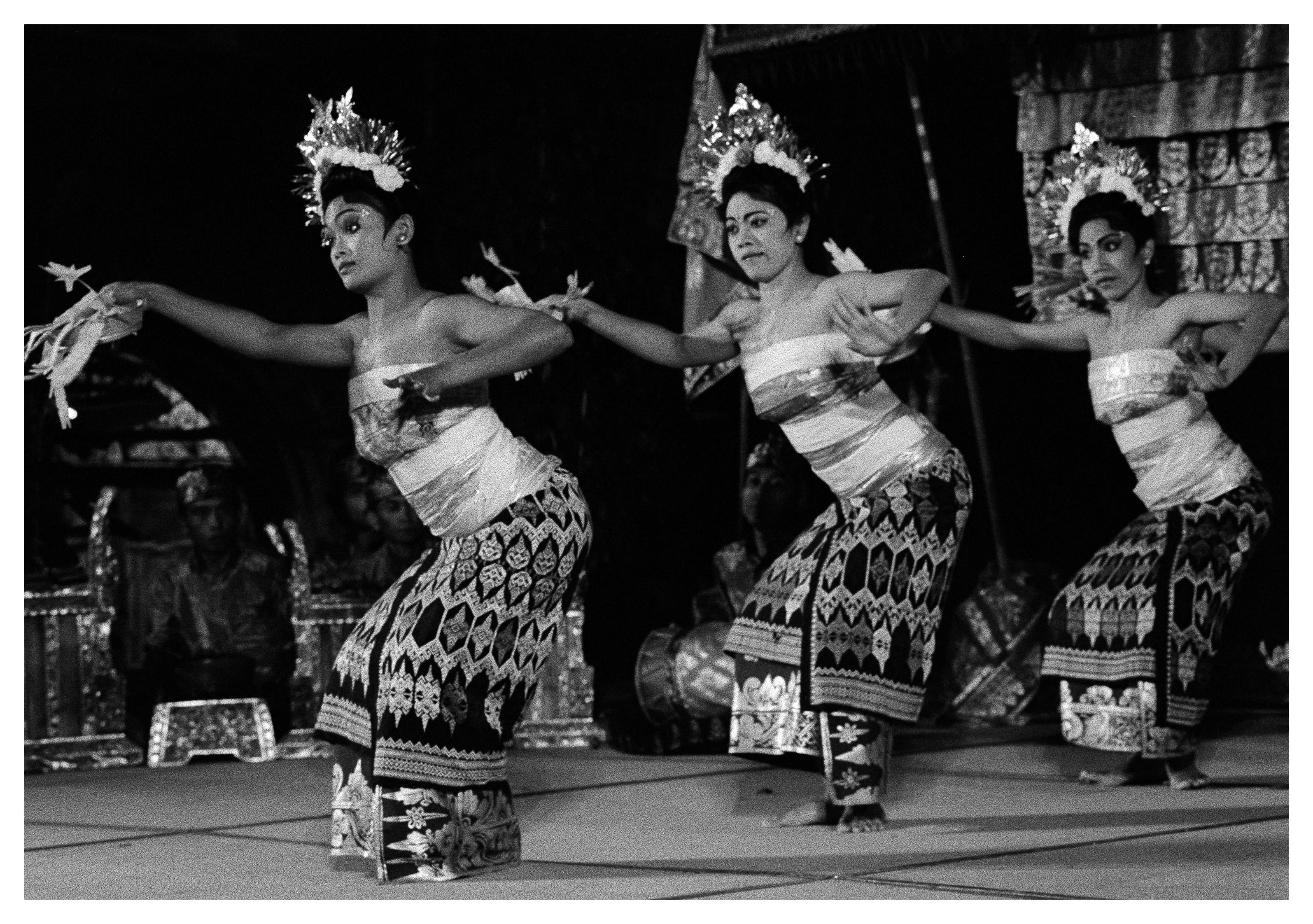 Three dancers in traditional dress