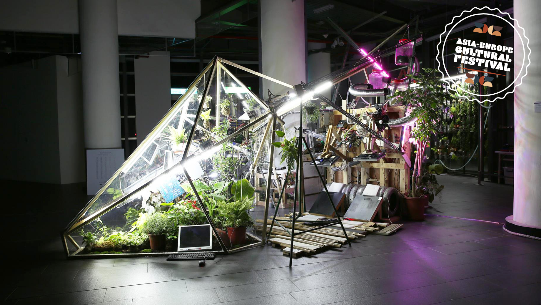 Photograph of an installation combining plants and natural elements with technology